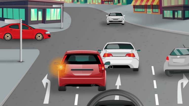 Wait and allow the oncoming vehicle to pass.