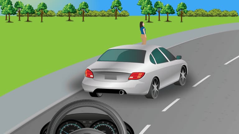 Reduce speed and remain ready to brake since the girl on the footpath could suddenly cross the road.