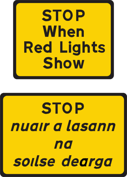 The driver must stop when red lights show.