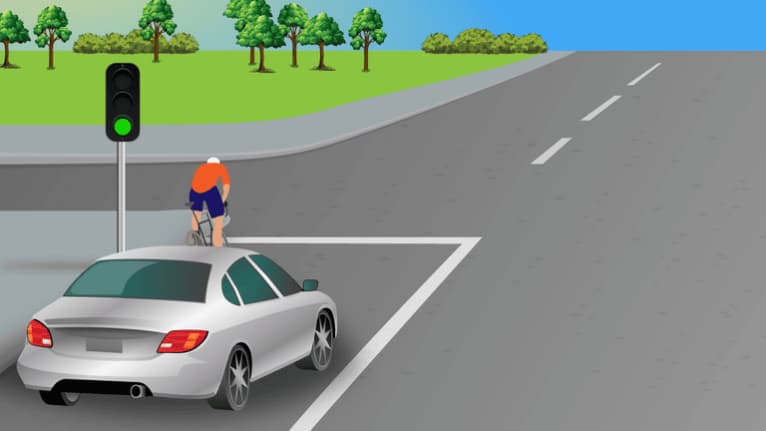 Allow the cyclist heading straight on to pass.