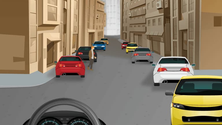 Pedestrians may cross between parked cars.